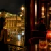 Clock and glass on an elegant bar counter in a Vienna nightlife setting