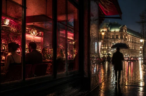 Rainy Vienna street at night with reflected lights and a warm lit bar window